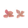 A pair of stud earrings made with real pink hydrangea flowers.